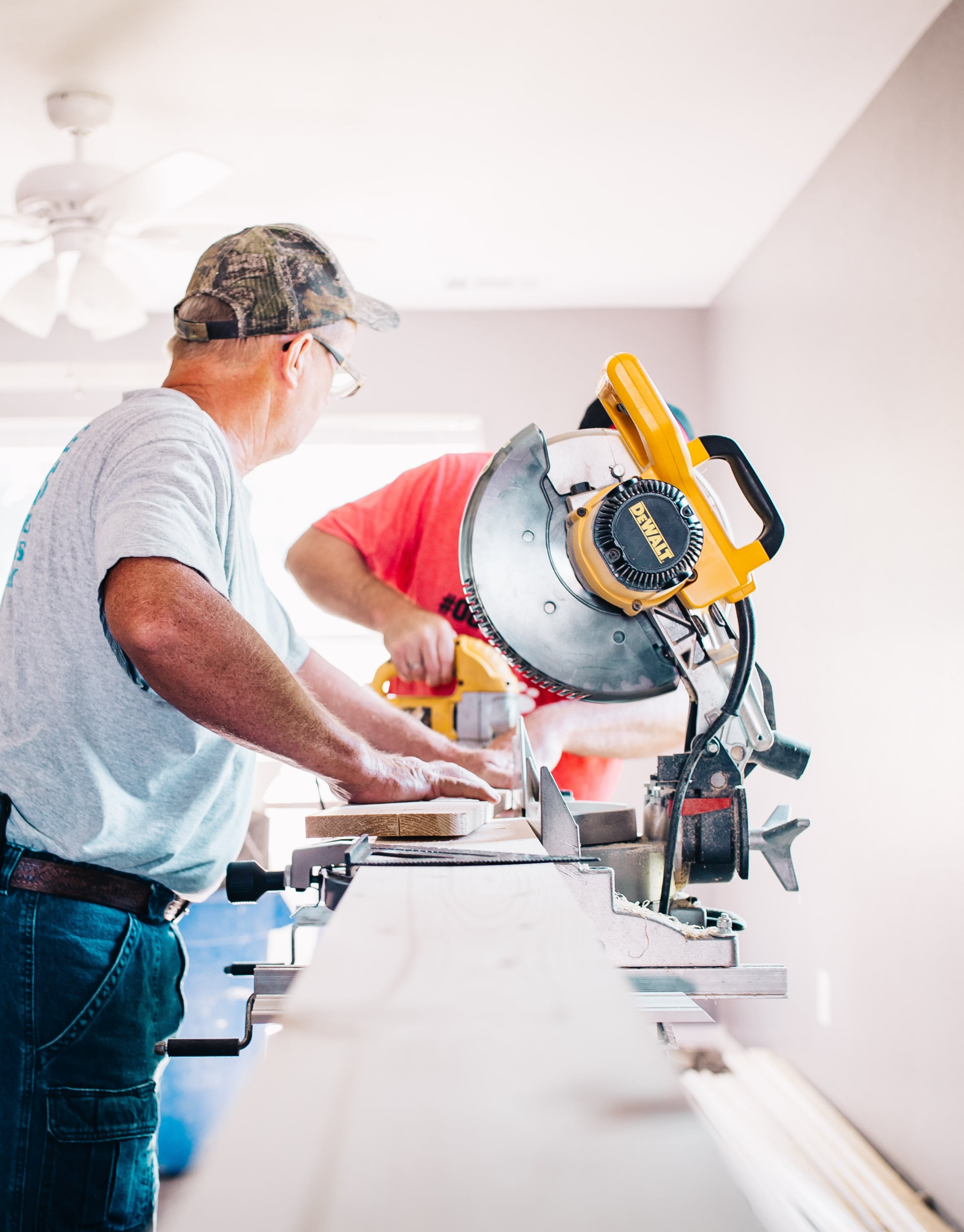 Workers cutting wood